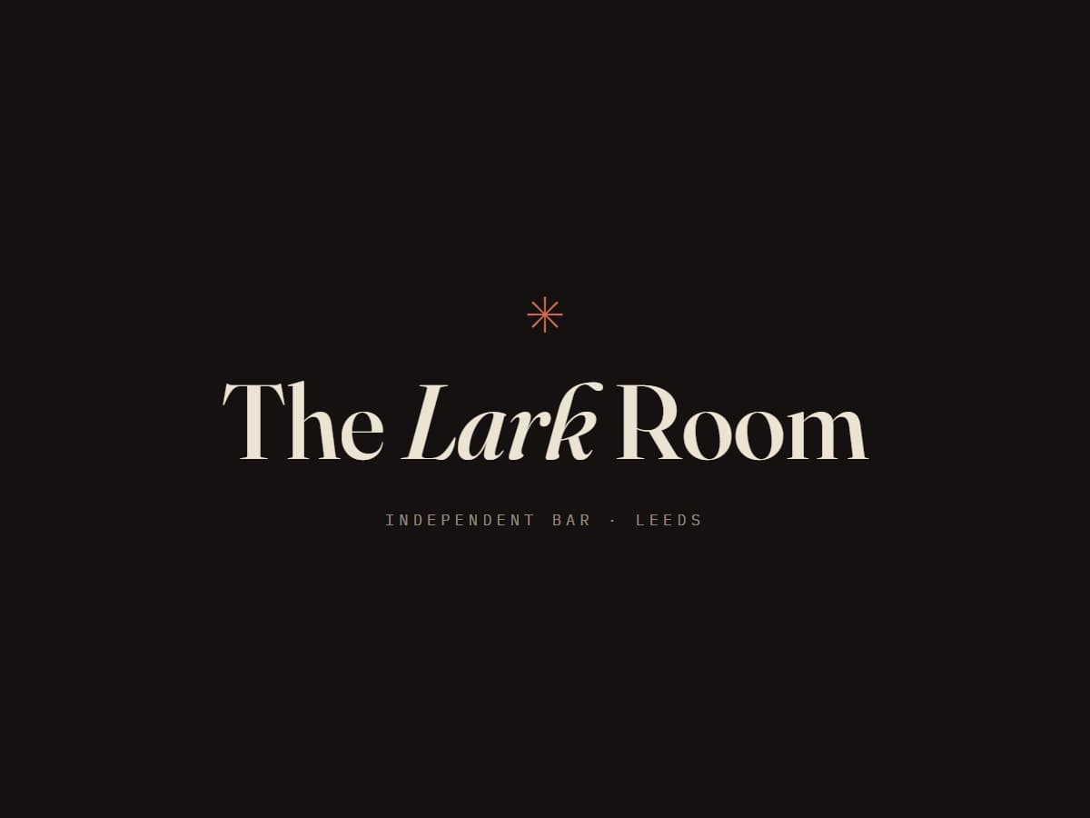 The Lark Room lockup: cream serif wordmark on near-black with a cherry star.